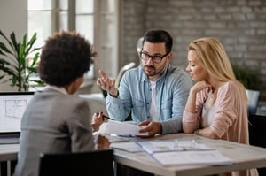 young couple discussing trust administration with an attorney 