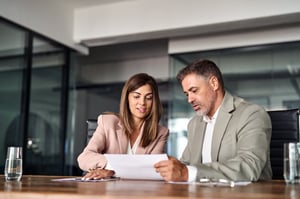 a lawyer showing client their appeals documents