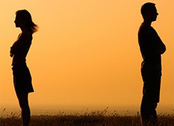 Man and woman facing away from each other