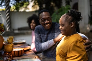 family laughing at the dinner table