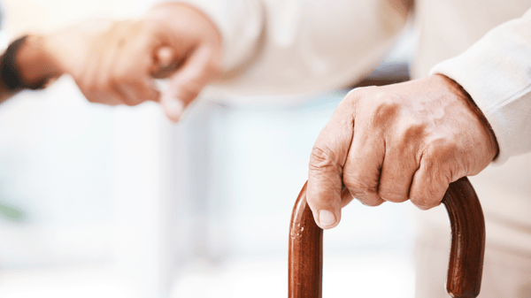 Hands caring for elderly