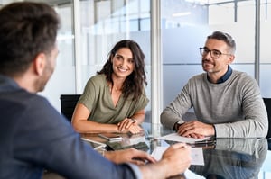 young couple meeting with attorney