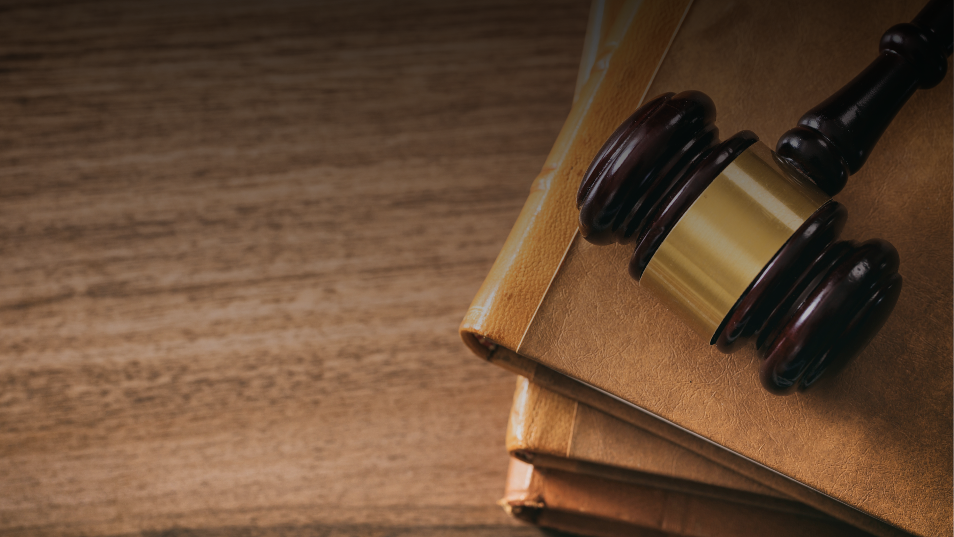 Desk, law texts and a gavel on the desk of a legal professional